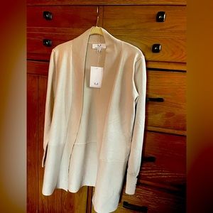 Pale Platinum light sweat with cute button detail on wrist